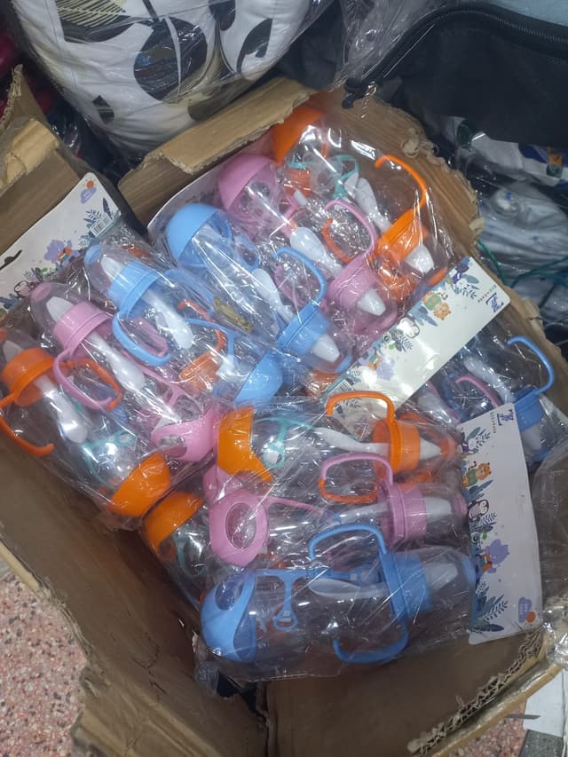 baby gift kit, towels, diapers, shoes, feeding bottles.